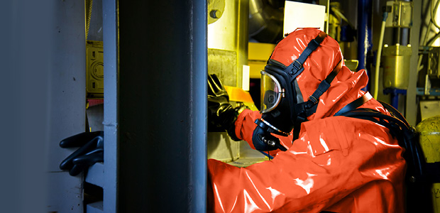 Technician in chemical protection gear