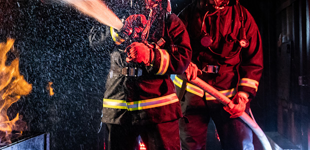 Firemen extinguishing fire