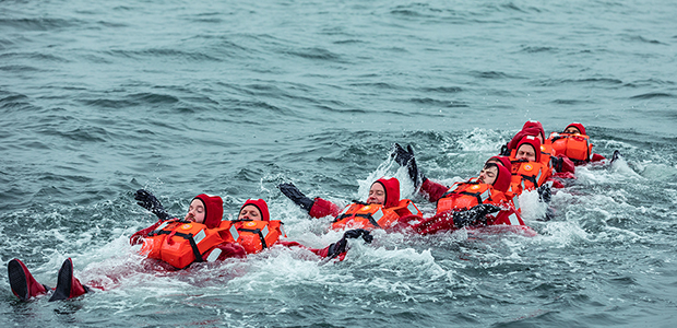People in Immersion suits and lifejackets